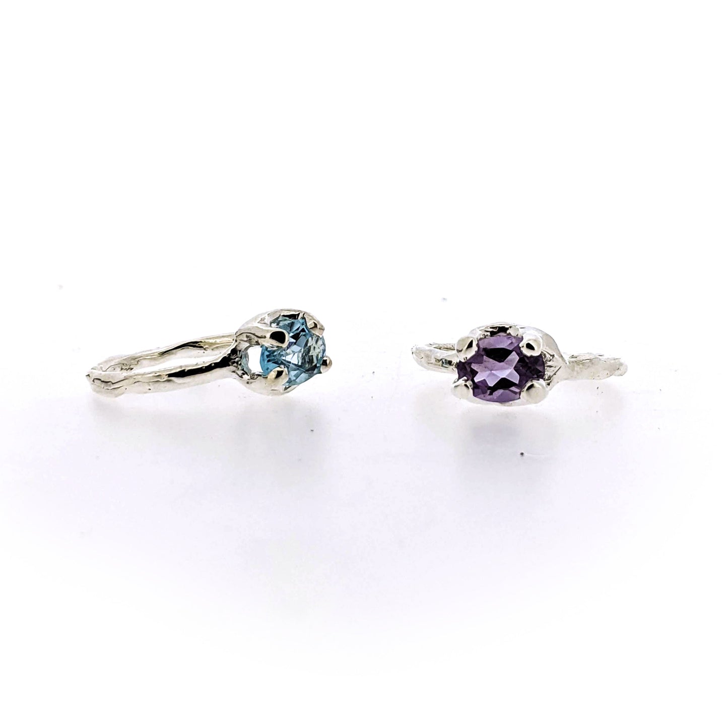 Full view of side and front profile of amethyst and blue topaz Ada Rings.