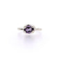 Full view of Ada Ring - Amethyst. This ring features an ovular shaped amethyst set in silver prongs on a silver band.
