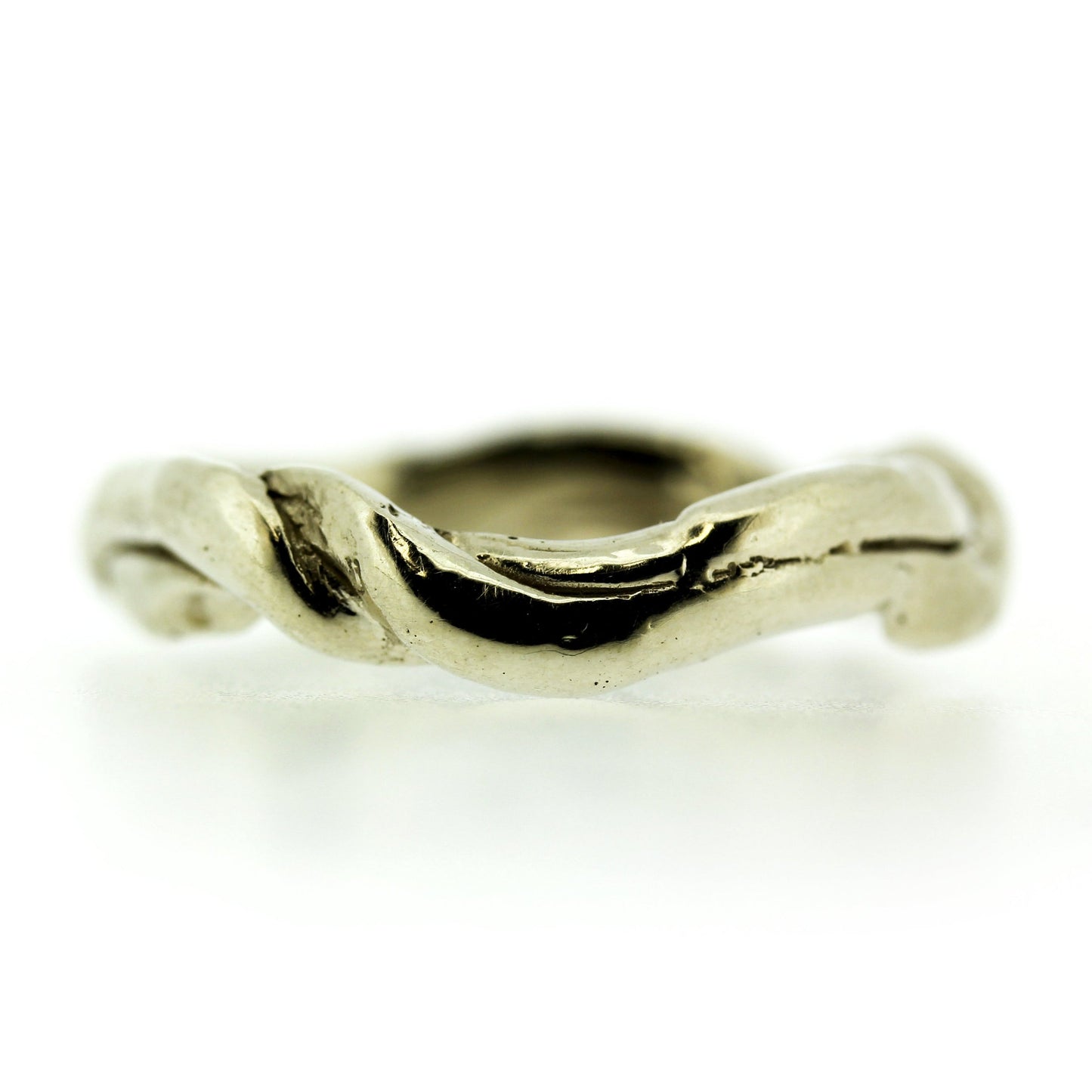 Full view of Men's Current Band. This band resembles a sea current with its twists and turns.