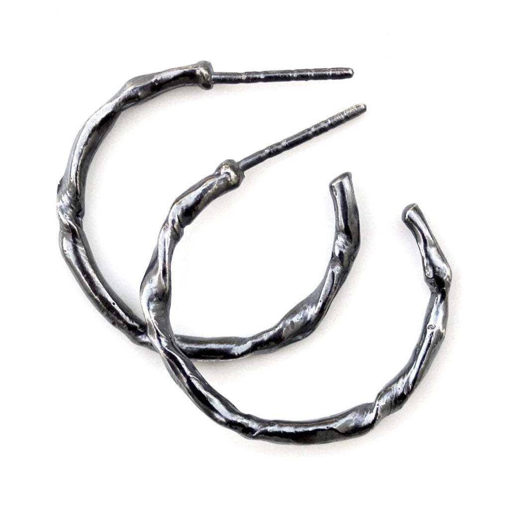 Blackened sterling silver twig hoop earring.