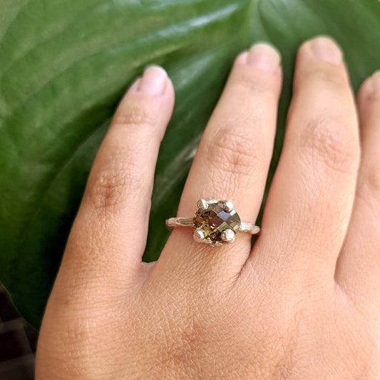 Full view of Ada Ring on woman's hand to help give an idea of its scale.
