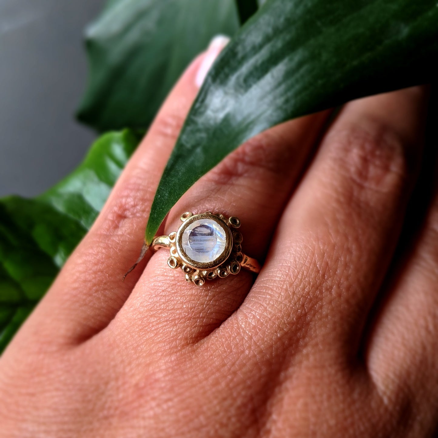 Close up view of Botania Ring on woman's hand.