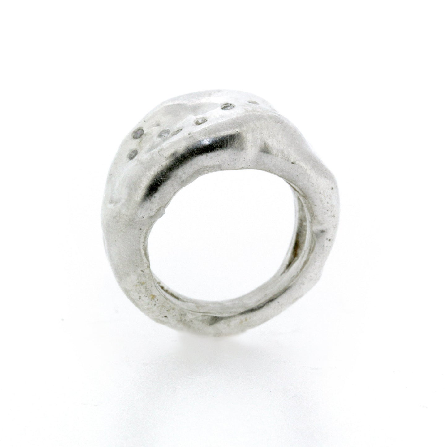 Full view of opening of Farah ring. Scattered Diamonds trail across a wide organic Sterling Silver band.