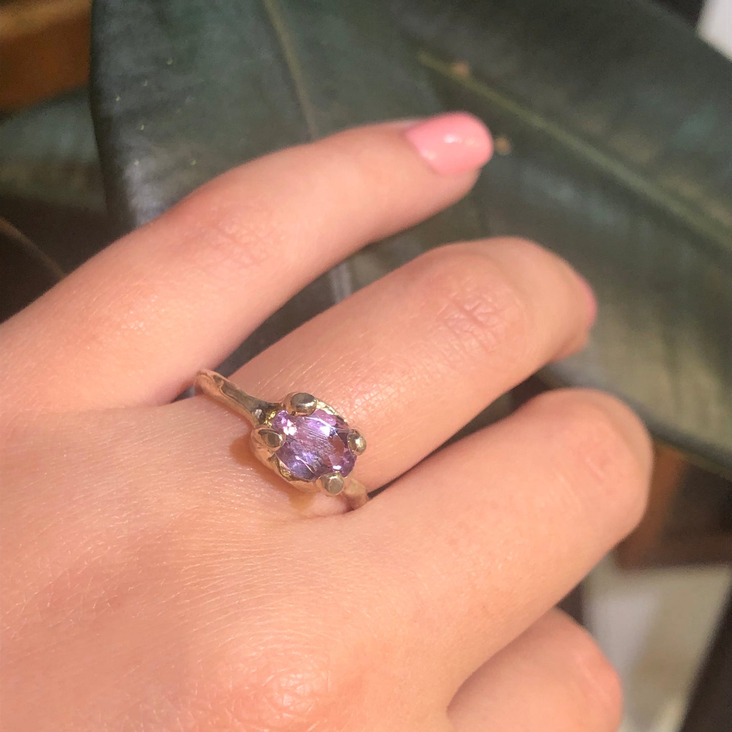 Full view of Ada Ring - Amethsyt on woman's hand to help give an idea of its scale.