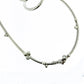 Detail shot of white sapphires on Tiffani necklace.