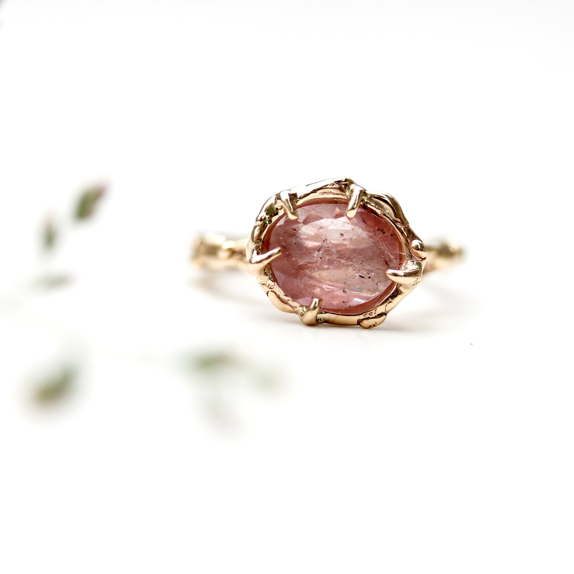 unique handmade pink sapphire engagement ring with hand wrought organic nature inspired dewdrop or water texture details