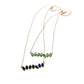 Full view of Sapphire and Peridot Cherin Necklaces on white background.