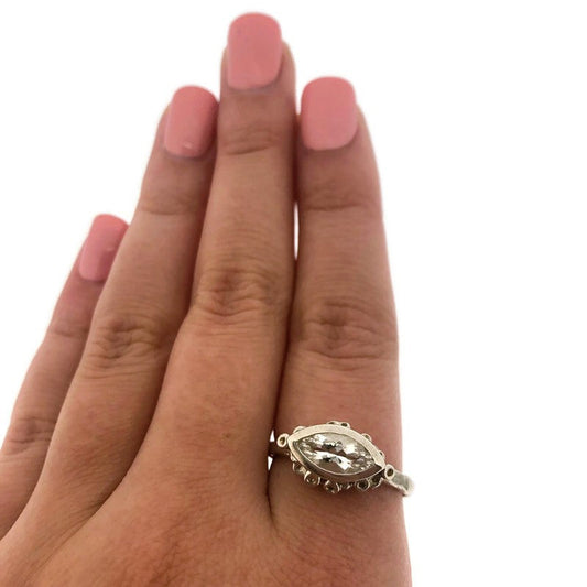 Full view of White Topaz Juliana Ring on woman's hand to help give an idea of its scale.