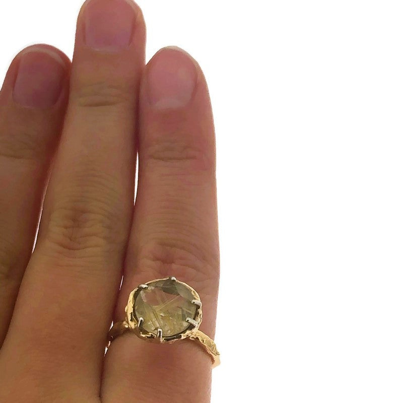 Full view of Rutilated Quartz Ring on a woman's finger to help give an idea of its scale.