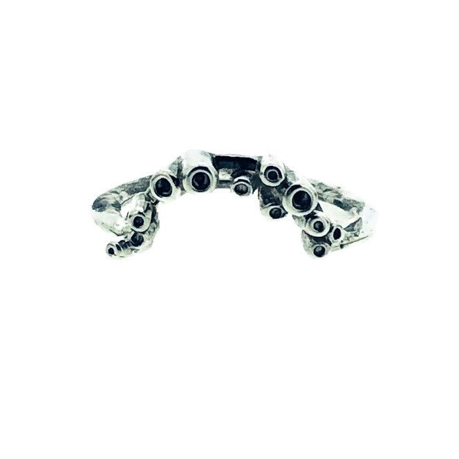 Full view of Sea Sponge Small Curve Ring on white background. This wedding band has a small curve of carved sea sponge texture on a thin silver band.