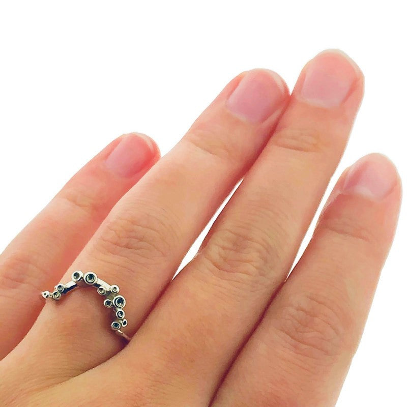 Full view of Sea Sponge Small Curve Ring on woman's hand to help give an idea of its scale.