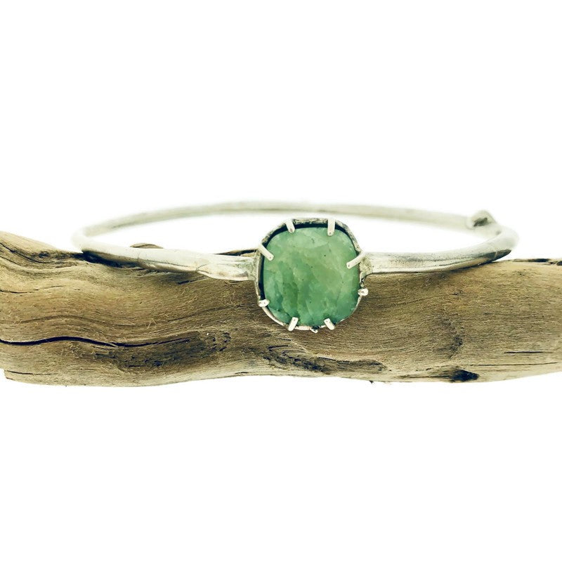 Full view of opaque emerald Shea Bangle with set square emerald on bangle.