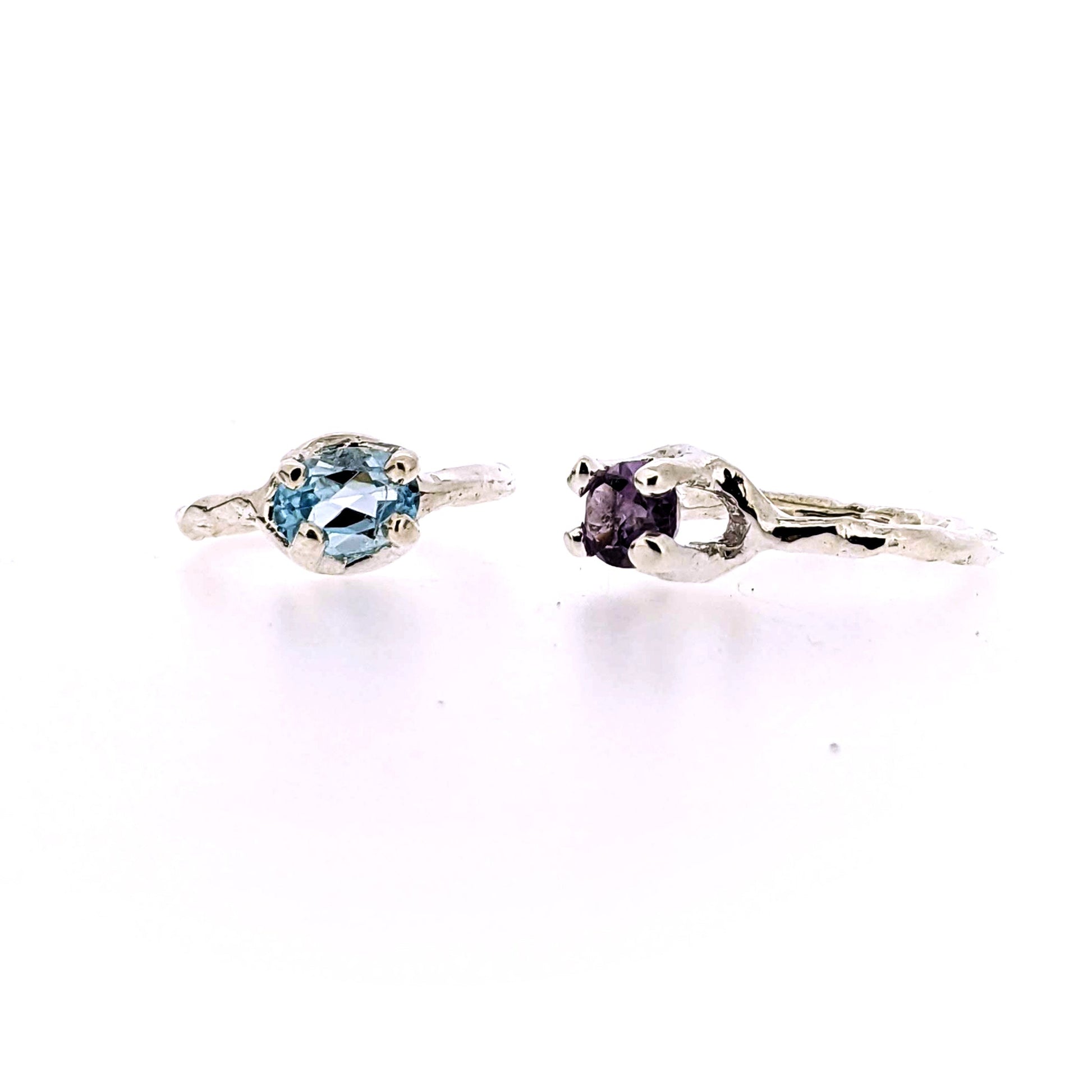 Full frontal and side view of blue topaz and amethyst Ada Rings.