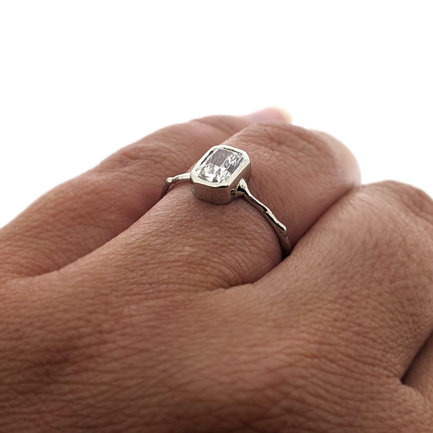 Angled view of AnnaBeth Diamond Ring on woman's hand to help give an idea of its scale.
