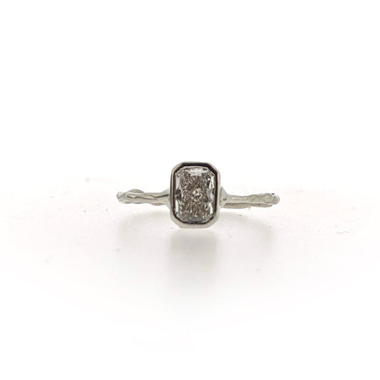 Full view of front of AnnaBeth Diamond Ring. This ring is made of white gold, has an organic texture throughout and a set rectangular shaped diamond at the top.