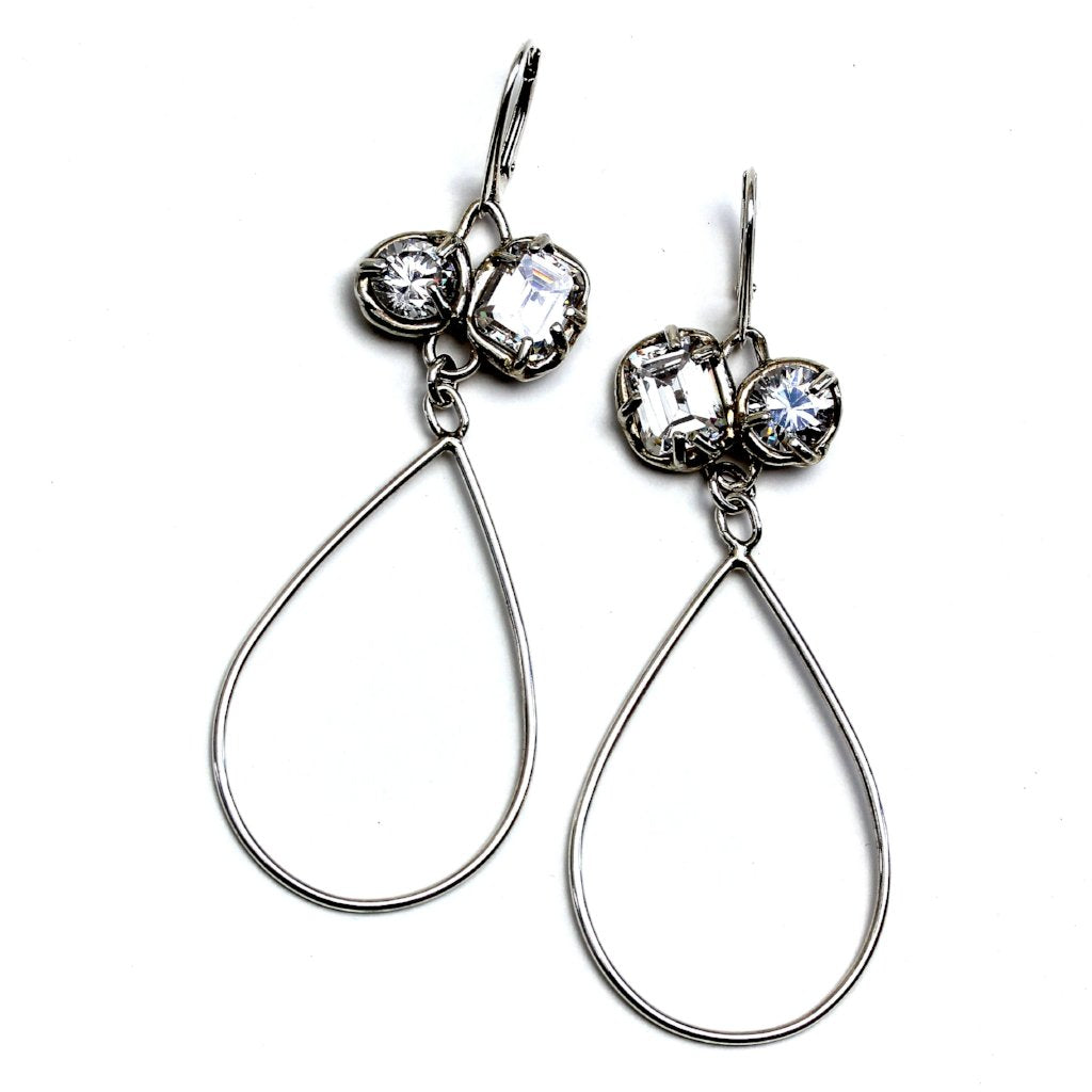 White topaz and sterling silver lever back earrings with long tear drop shaped dangle.
