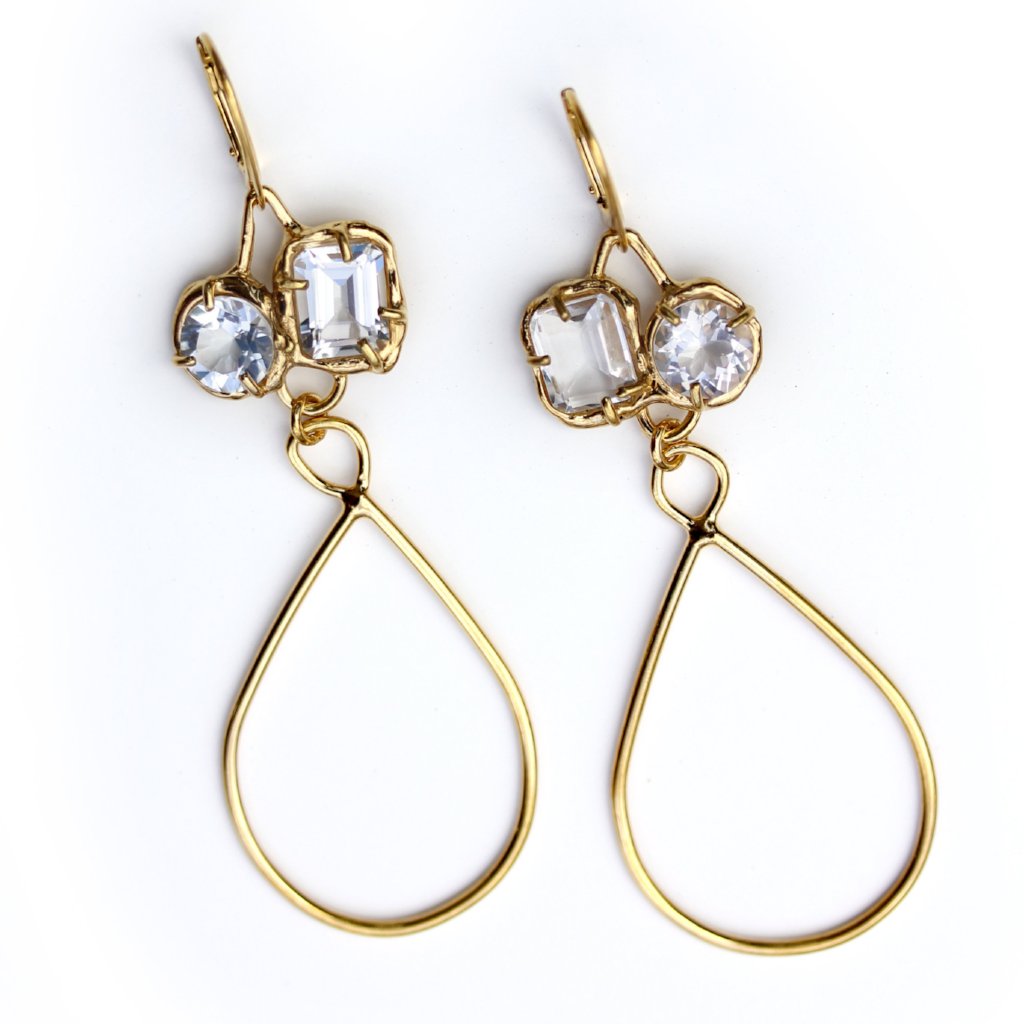 Gold dangle earrings with organic prong set White topaz gemstones and long golden tear drop shaped accents.