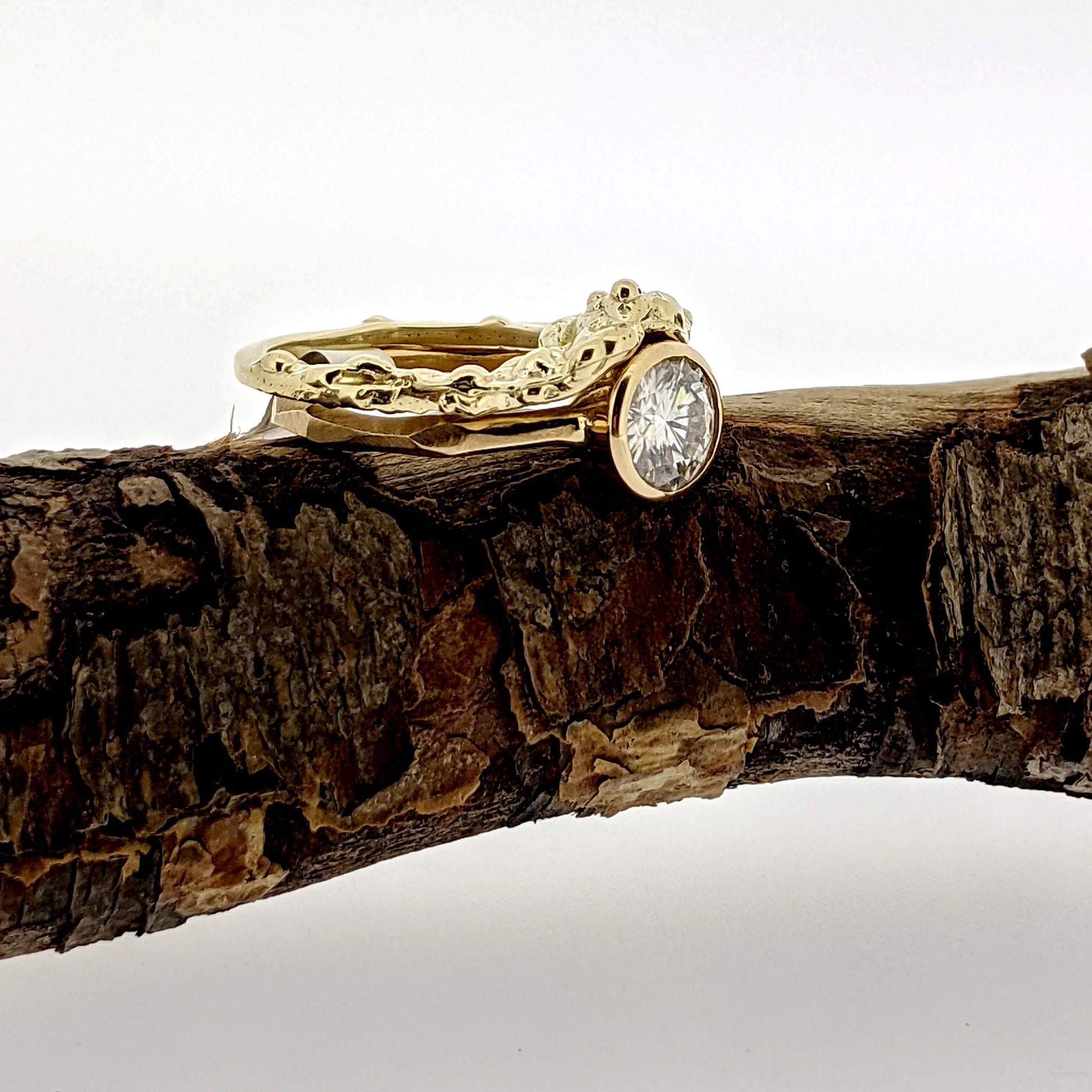 Full view of Barnacle Shadow Band and engagement ring on branch