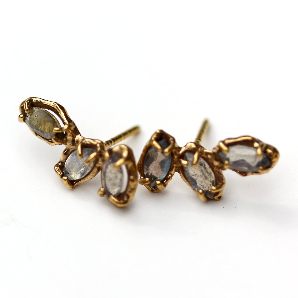 Gold earrings with three marquise shaped labradorite stones set with organic prongs.