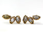 Stud earrings made of three marquise shaped labradorite gemstones set with organic prongs.