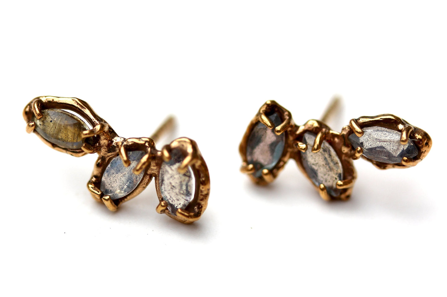 Organic looking stud earrings with prong set labradorite gemstones.