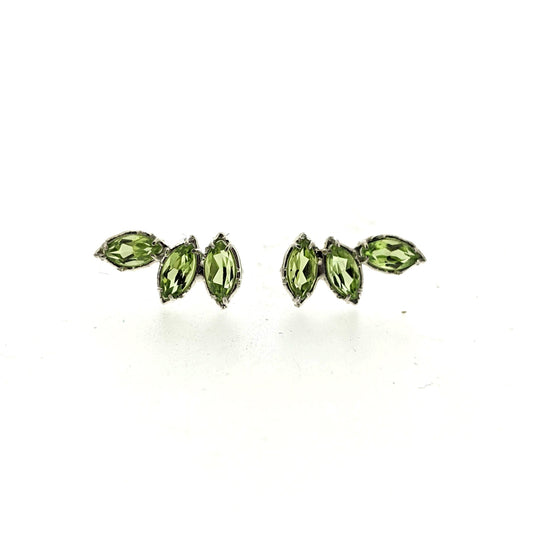 Full view of Peridot Cambrye Earrings. These crawler earrings each showcase three set marquise shaped peridot in silver.