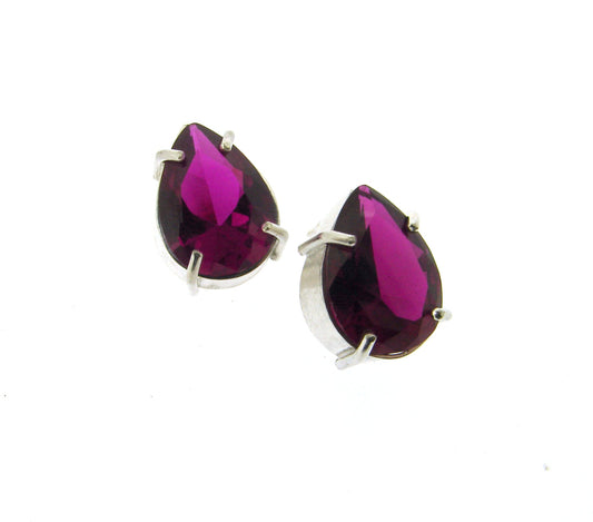 Full view of Embry Earrings. these studs have a pear shaped ruby set with four silver prongs.