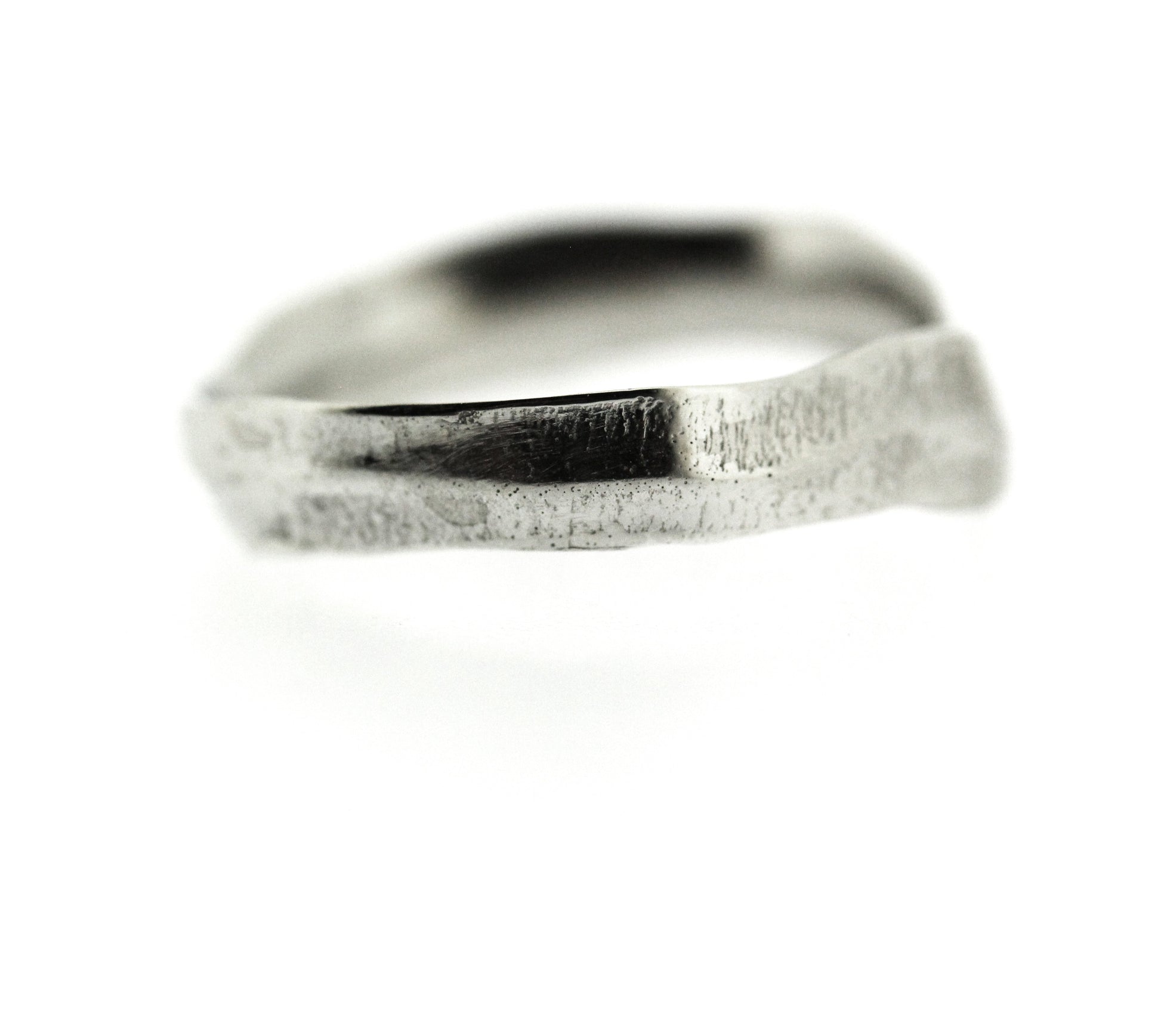 Close up view of side of white gold Frond Arch Band.