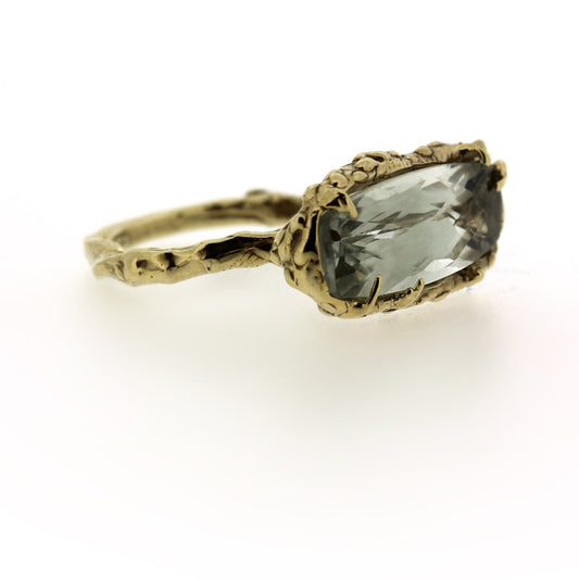 Side view of Sylvian Ring. A unique elongated rectangular cushion cut Prasiolite is set in organic textured 14K Yellow Gold.  Hand carved and one of a kind.  