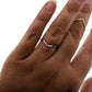 dainty organic pink sapphire arched shadow band stacking ring with marquise shaped stone in two tone band