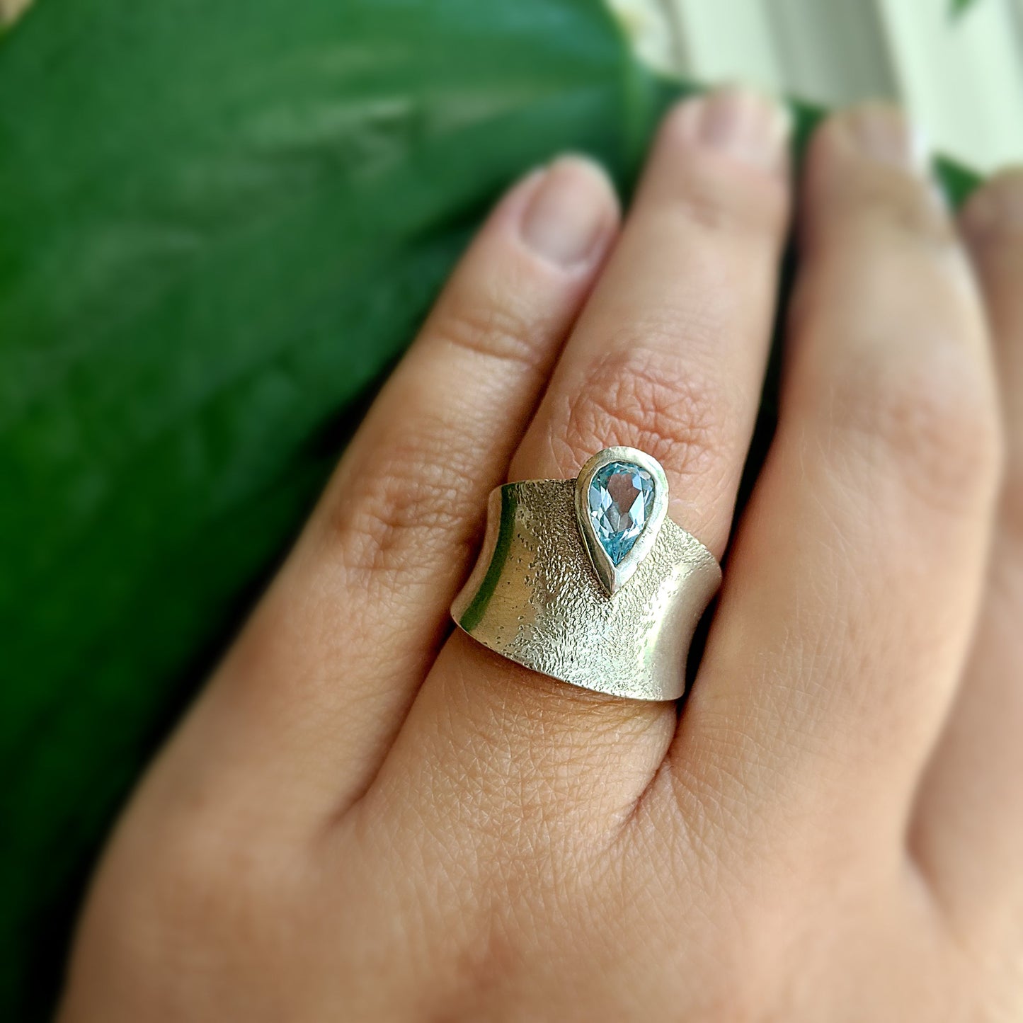 Full view of Astoria Ring on woman's hand to help give an idea of its scale.