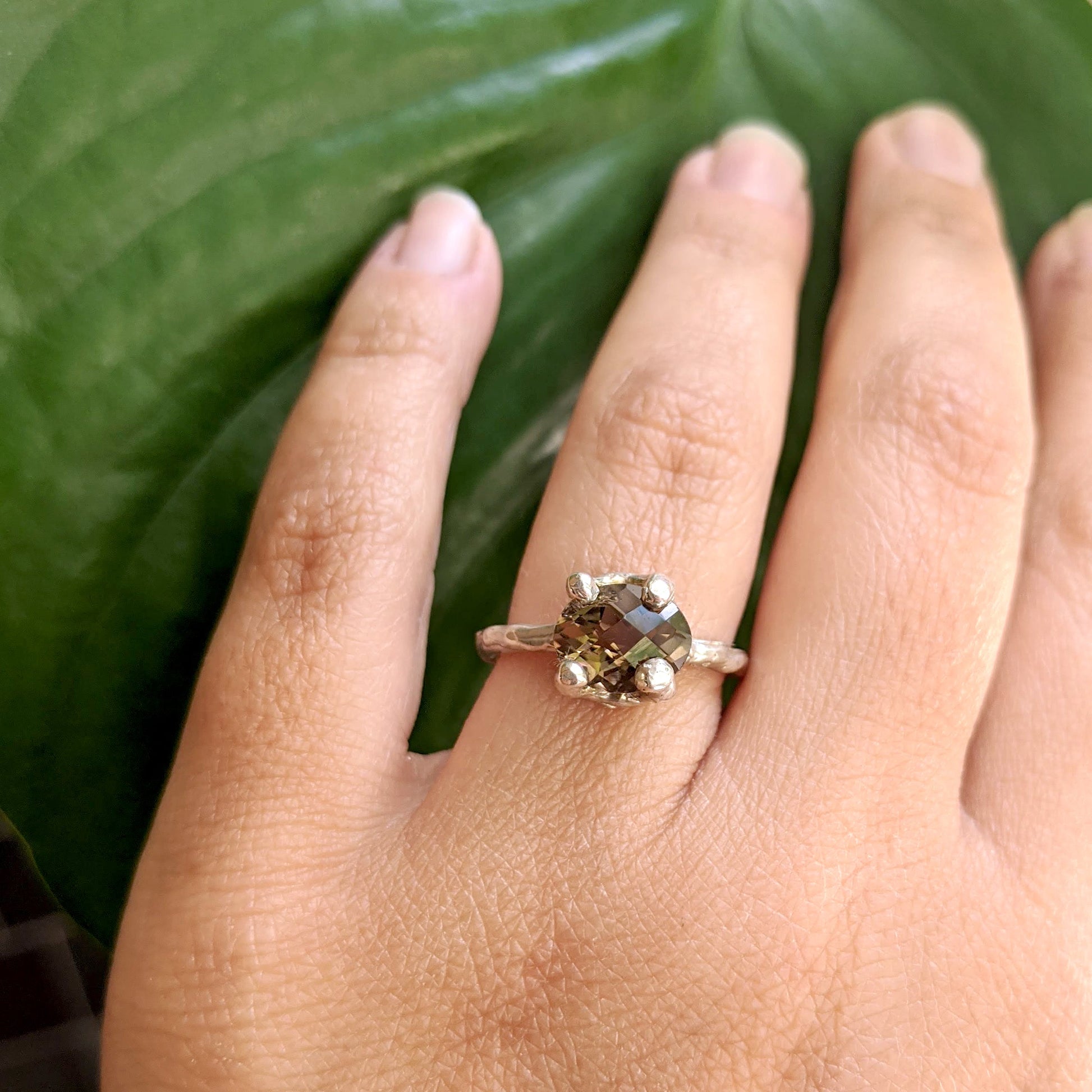 Full view of Ada Ring on woman's hand to help give an idea of its scale.