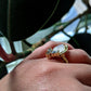 Full view of side of Celeste Ring on woman's hand to help give an idea of its scale.