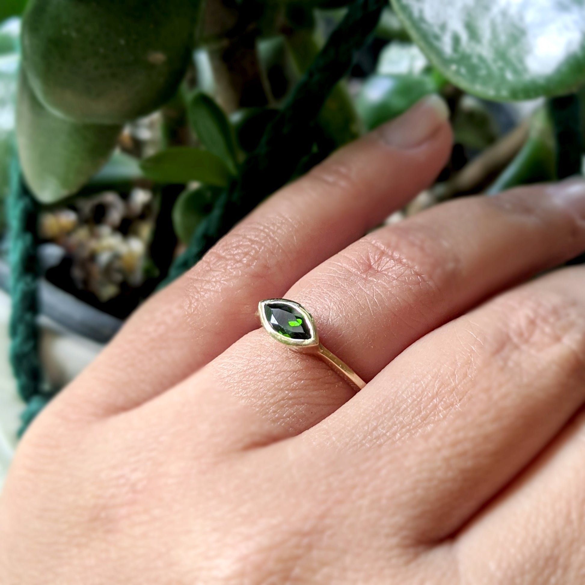 Full view of Olive Ring on woman's hand to help give an idea of its scale.