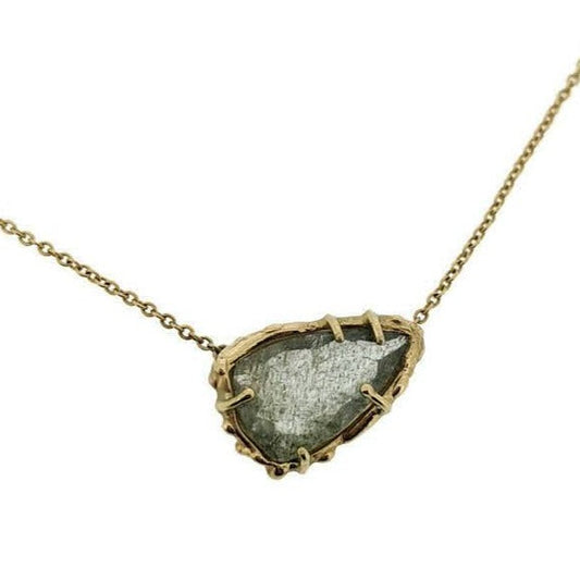 Close up view of pendant on Edie necklace. A lovely moss aquamarine gemstone is surrounded by organic, highly textured 14K solid Yellow Gold. 