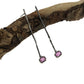 Full view of Pink Sapphire Gina Dangle Earrings laying on top of a stick.
