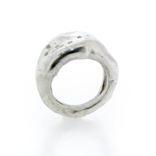 Full view of opening of Farah ring. Scattered Diamonds trail across a wide organic Sterling Silver band.