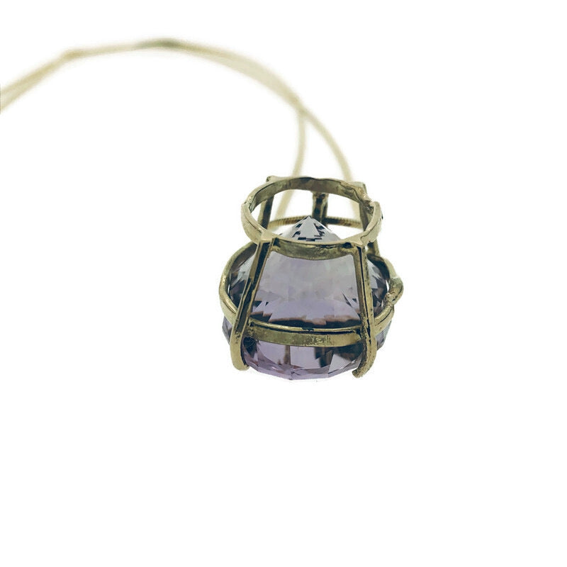 Detail shot of side profile of setting on amethyst gemstone.