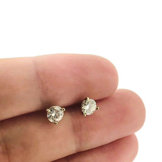 Full view of Lab Grown Diamond Stud Earrings in-between two fingers to help give an idea of their scale. 