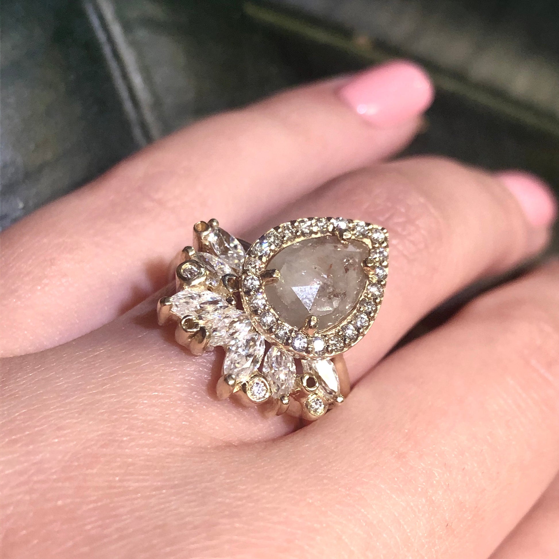 Full view of Ana Ring - Rustic Diamond paired with its stackable wedding band on woman's hand to help give an idea of its scale. 