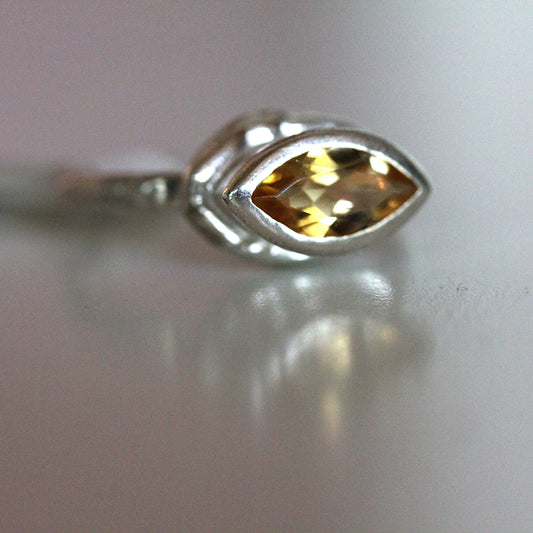 Close up view of precious topaz gemstone on Corinna Ring.