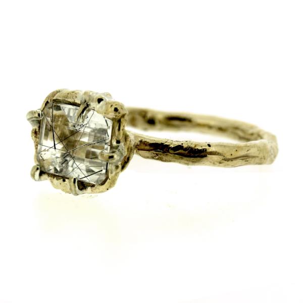 Side view of an organic inspired ring made in 14k yellow gold and tourmalinated quartz
