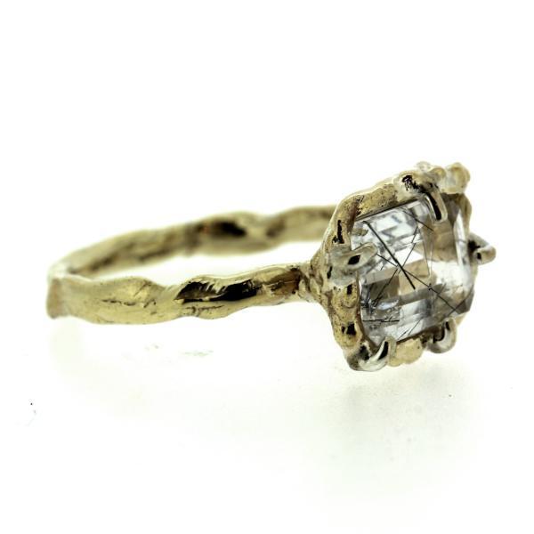 Side view of an organic inspired ring made in 14k yellow gold and tourmalinated quartz