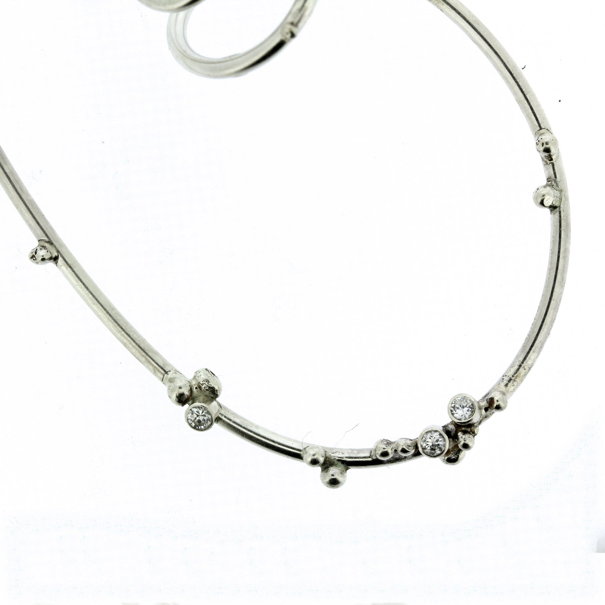 Detail shot of white sapphires on Tiffani necklace.
