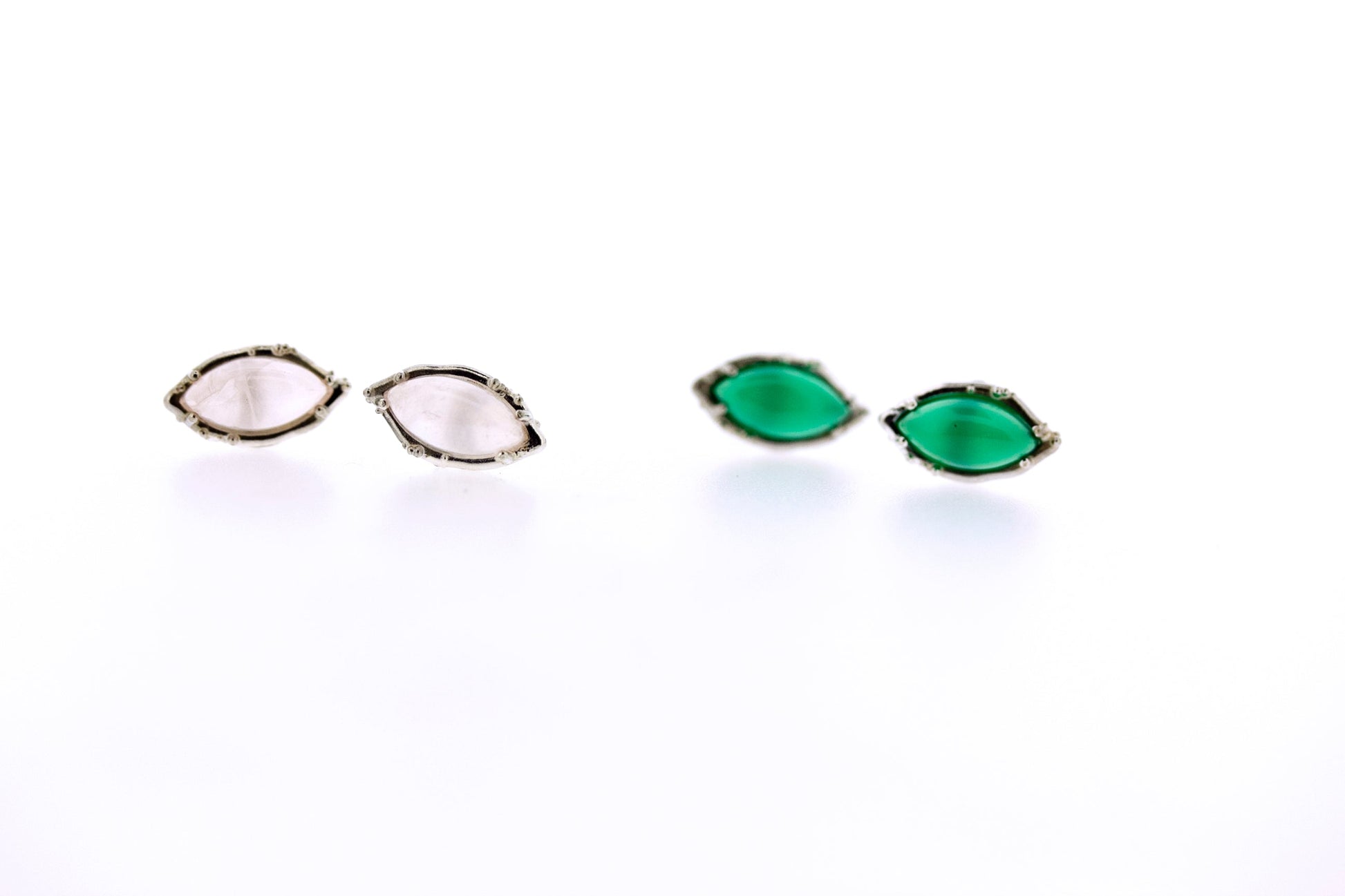 full view of Rosa - Rose Quartz and Green Onyx earrings sitting next to one another.