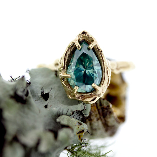 Full view of Nessa Ring with moss in background