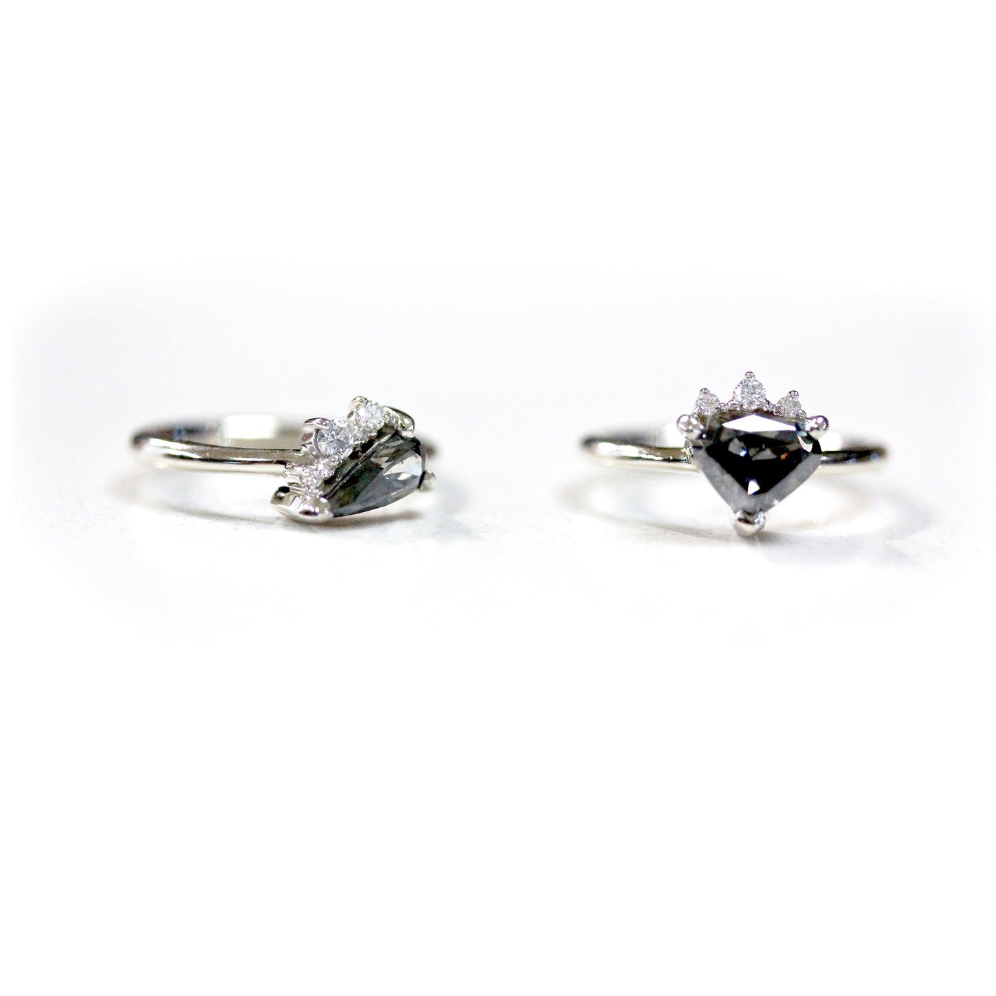 Full view of Penelope Ring and secondary ring sitting next to one another.
