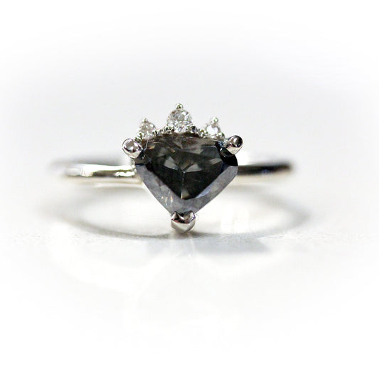 Full view of Penelope Ring. One of a kind diamond partial halo design featuring a 1.06 Carat Intense Fancy Gray Moissanite set in 14K white gold.     Three dainty Lab Grown diamonds are nestled intimately next to a beautiful, unique cut pear shaped center Moissanite.  