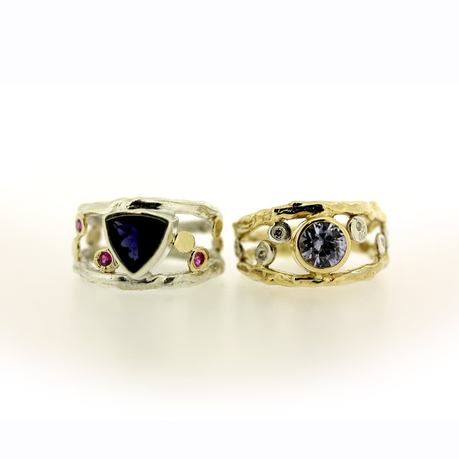 Color change sapphire, diamond, and 18K gold organic ring by Katie Poterala Jewelry, side by side with Iolite and pink sapphire ring in sterling silver