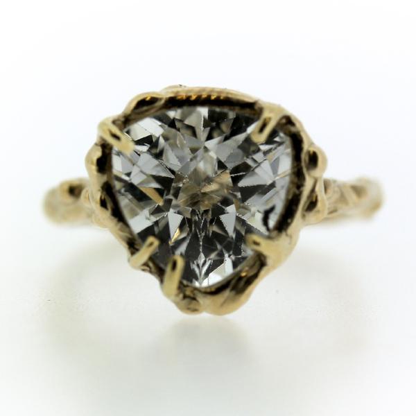 14k yellow gold and Trillion shaped white topaz ring in an organic prong setting